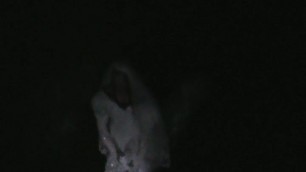 big wedding gown in a ditch at night
