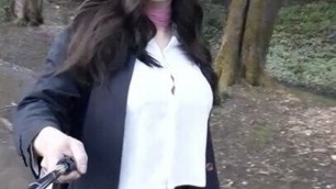crossdresser wearing a short leather skirt walking in the park in Waterfoot Lancashire