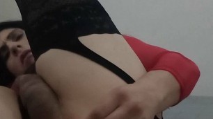 Sexy Colombian crossdresser wearing a red dress takes dildo in her ass