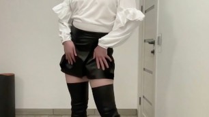 Sissy BDSM in leather shorts skirt and white office blouse